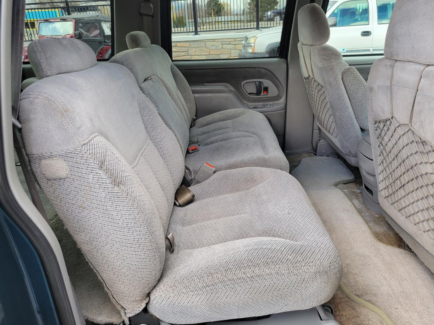 1998 Green /Gray GMC Suburban SLE (3GKFK16R9WG) with an 5.7L V8 engine, 4 Speed Auto transmission, located at 450 N Russell, Missoula, MT, 59801, (406) 543-6600, 46.874496, -114.017433 - 4WD SUV. 5.7L V8 Engine. 4 Speed Automatic Overdrive Transmission. Front and Rear Climate Control. AM FM CD Cassette. Air Cruise. Tilt. Power Front Seats. Power Windows and Locks. Towing. Running Boards. 3rd Row Seating. Because of the Age, financing is not available on this vehicle. - Photo#10